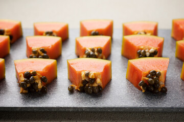Papaya pieces on a chopping board