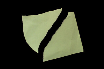 Torn paper piece isolated on black background