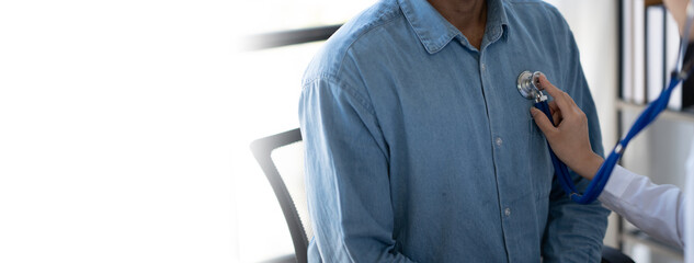 Doctor using a stethoscope checking patient with examining, presenting results symptom and...
