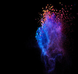 Flying holi powder paint explosion over black abstract background