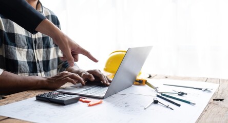 In engineering bureau engineers discussing technical construction