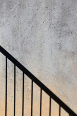 Staircase shadow on concrete wall