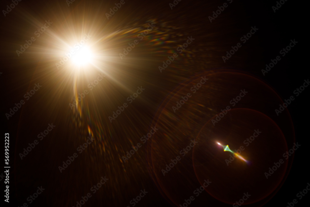 Aufkleber Easy to add lens flare effects for overlay designs or screen blending mode to make high-quality images. Abstract sun burst, digital flare, iridescent glare over black background.