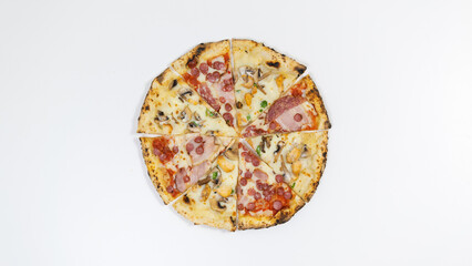 Pieces of pizza lie on a white plate. White background.