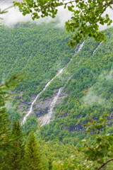 a small waterfall on the side of a mountain
