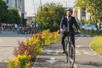 Successful executive in suit smiling, while riding on bike path outside.