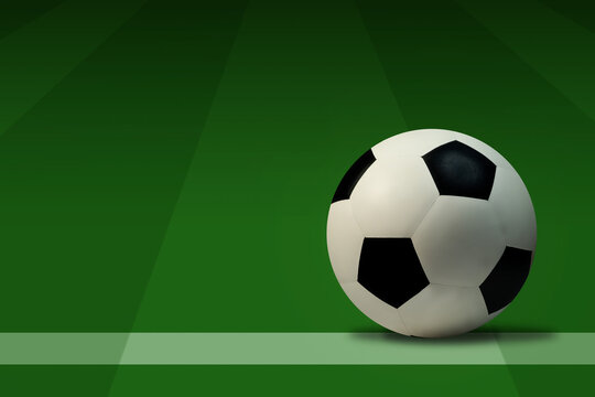 Soccer ball on green grass with copy space for text.