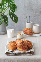 Almond croissant bakery homemade on the table.Traditional French breakfast 