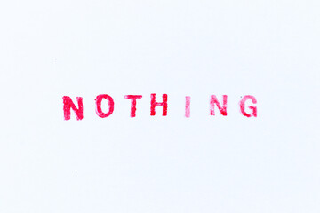 Red color ink rubber stamp in word nothing on white paper background