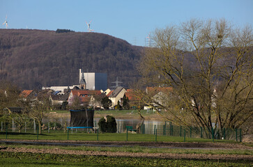 Würgassen, Germany - 03 23 2020: Nuclear power plant with houses of the village of Würgassen and...