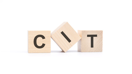 CIT - wooden blocks with letters, top view on white background