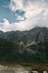 High-angle view of mountain landscape and lake at vibrant sunset. Beautiful non-urban landscape.