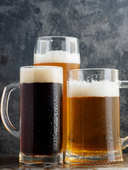 Three cold beers close-up, dark, lager and wheat