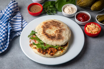 Delicious looking cold sandwich served with coleslaw sauce.