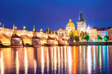Fototapeta na wymiar charming evening city landscape over the Vltava river in the old city of Prague, Czech Republic