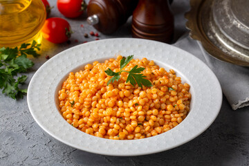 Couscous pilaf with tomatoes. Turkish name; domatesli kuskus pilavi