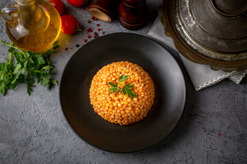 Couscous pilaf with tomatoes. Turkish name; domatesli kuskus pilavi