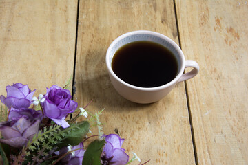 Obraz na płótnie Canvas cup of coffee with flowers