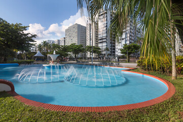 City of Santos, Brasil. Frog Fountain, beach gardens and waterfront buildings. Long exposition photography.