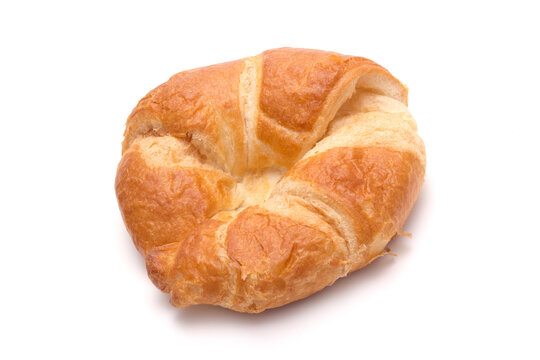 Fresh round croissant on white