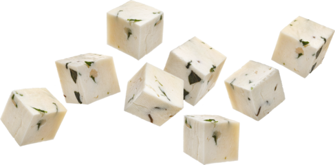 Falling feta cubes, diced curd cheese pieces with herbs and spices isolated