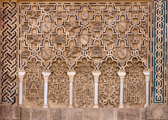 Moors ornaments on the walls of Royal Alcazar Palace in Granada