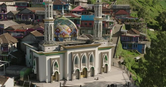Aerial: Drone Shot Of Masjid Baituttaqwa Butuh On Hill During Sunny Day - Java, Indonesia