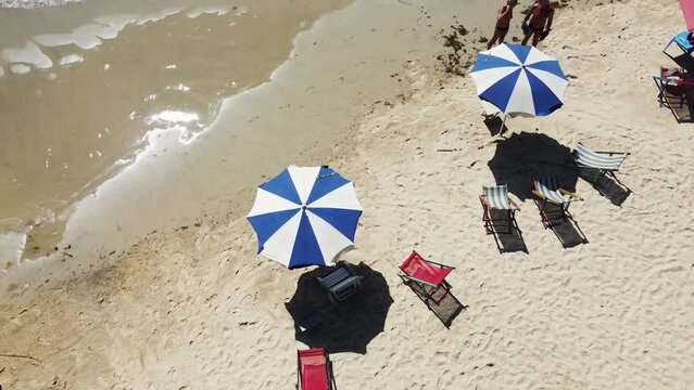 Chairs and beach awnings, nueva esparta bayside beach, margarita island, venezuela. Caribbean sea, atlantic ocean.