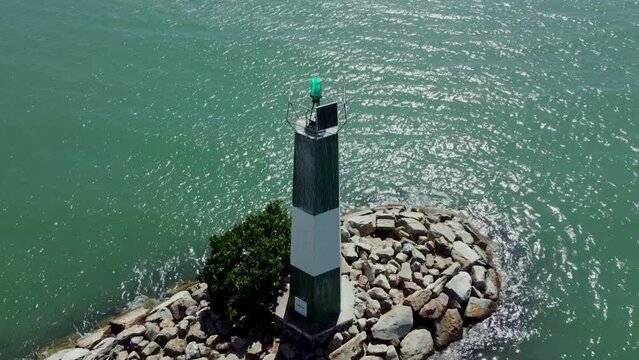 Nueva esparta bayside beach lighthouse, margarita island, venezuela. Sunny day in the beautiful caribbean sea, atlantic ocean.