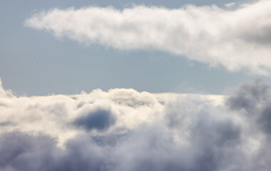 Fototapeta na wymiar Aerial View of White Puffy Cloudscape in British Columbia, Canada. Nature Background