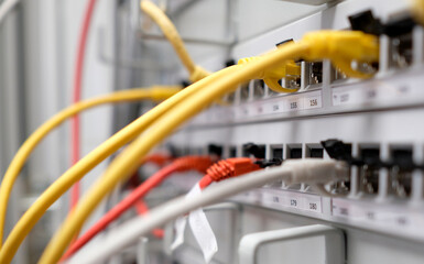 Network technology - multiple colorful cables in an IT and server room