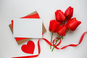 greeting card happy valentine's day. bouquet of tulips and red heart	