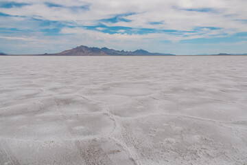 Scenic view of Bonneville Salt Flats in western Utah with Silver Island Mountains peaks in the...
