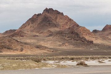 Scenic view of sharp mountain of Volcano Peak in the Silver Island Mountain range near the Bonneville Salt Flats in Wendover, Western Utah, USA, America. Barren deserted landscape near Salt Lake City