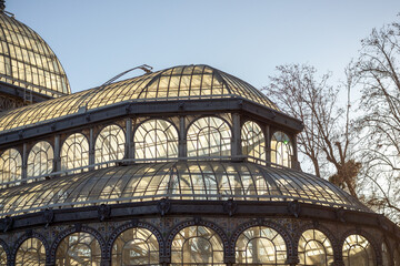 Structure with large windows through which light passes in different ways, vegetation and nature,...