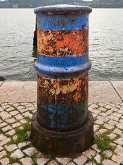 Naklejka premium Rusty and old mooring in a river pier