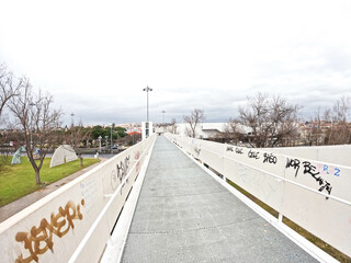 Pedestrian overpass with white railings