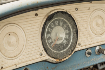 Old vintage dashboard of an american  oldtimer car with white and blue colors