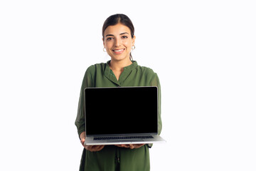 A young modern smiling Indian Asian female or woman holding a laptop in her hands and showing a...