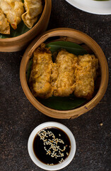 Fried Chinese Spring rolls or Lumpia  contain stir fried bamboo shoots, vegetables, eggs, and chicken or shrimp.