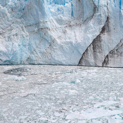 Ice texture backgroung and wall of ice and water full of pieces of ice in glacier frozen lake in Patagonia