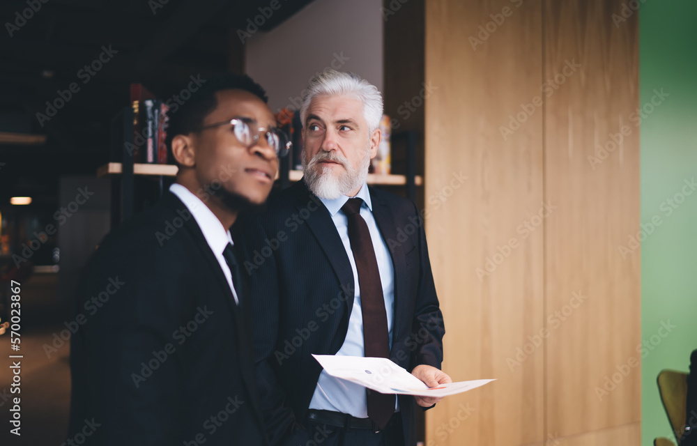 Sticker multiracial businessmen in suits working in modern workplace