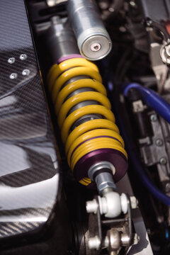 Motorcycle shock absorber with metallic springs