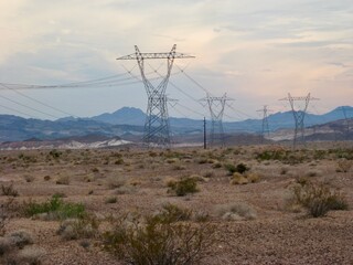 Power Line Towers at Sunset after Storm in Desert Southwest