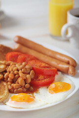 Traditional British breakfast with sausages and beans