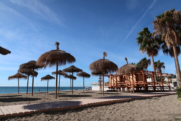 Umbrellas on the beach of Nerja at Spains Costa del Sol