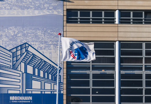 Waving flag of the FC Copenhagen (Dan. FC K&oslash;benhavn) on the facade of Parken Stadium. Copenhagen, Denmark - May 2022