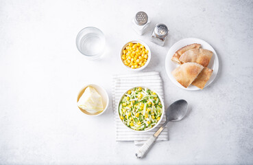 Cabbage cucumber corn salad in a bowl