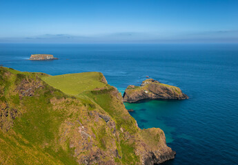 Portaneevey Port of the Caves. This vantage point, located on the Causeway Coastal Route in Northen Ireland, looks out over several islands namely, Rathelin, Carrick-a-Rede and Sheep Island.