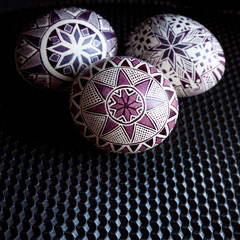 Modern Ukrainian Easter eggs on a background of black sheet beeswax